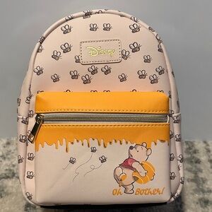 Disney Pink Cream Winnie the Pooh Bee Print Mini Backpack with Yellow Accent